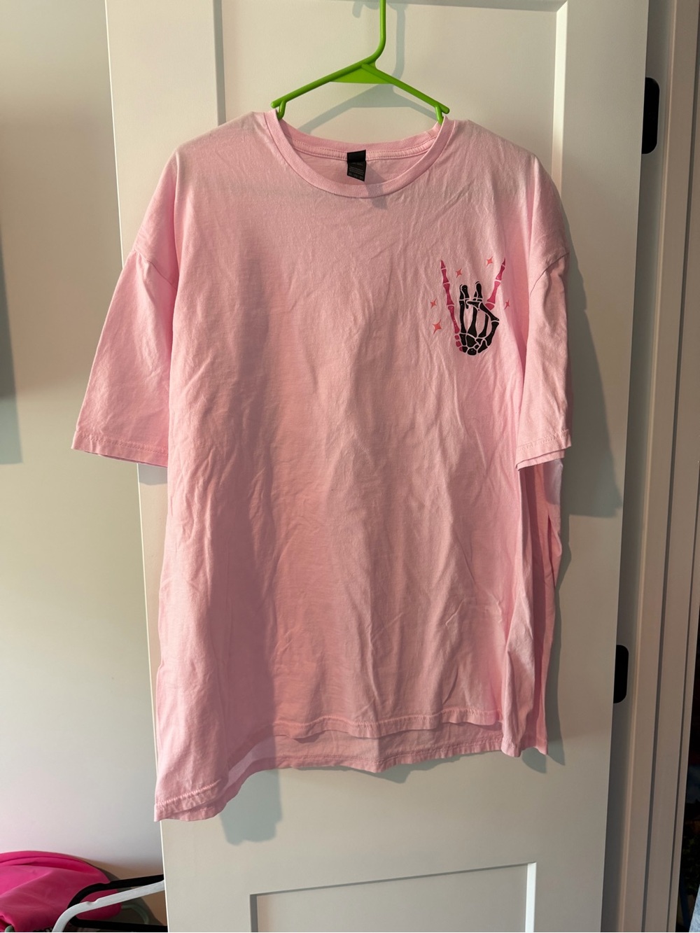 Pink Graphic Tee with Skeleton Hand Design